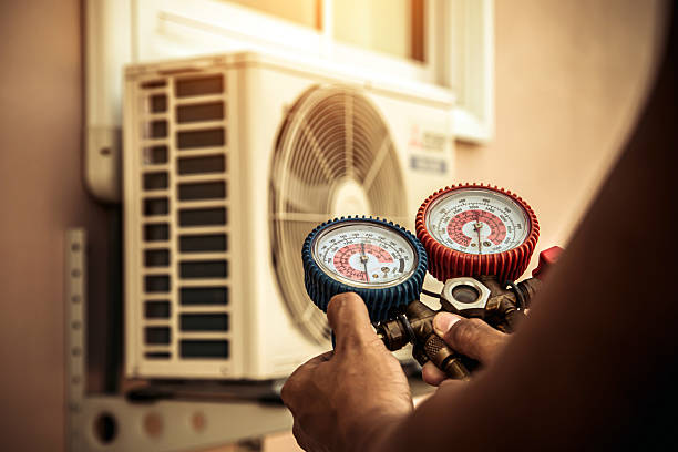 Professional Air Conditioning Service technician working in Homer Glen, IL